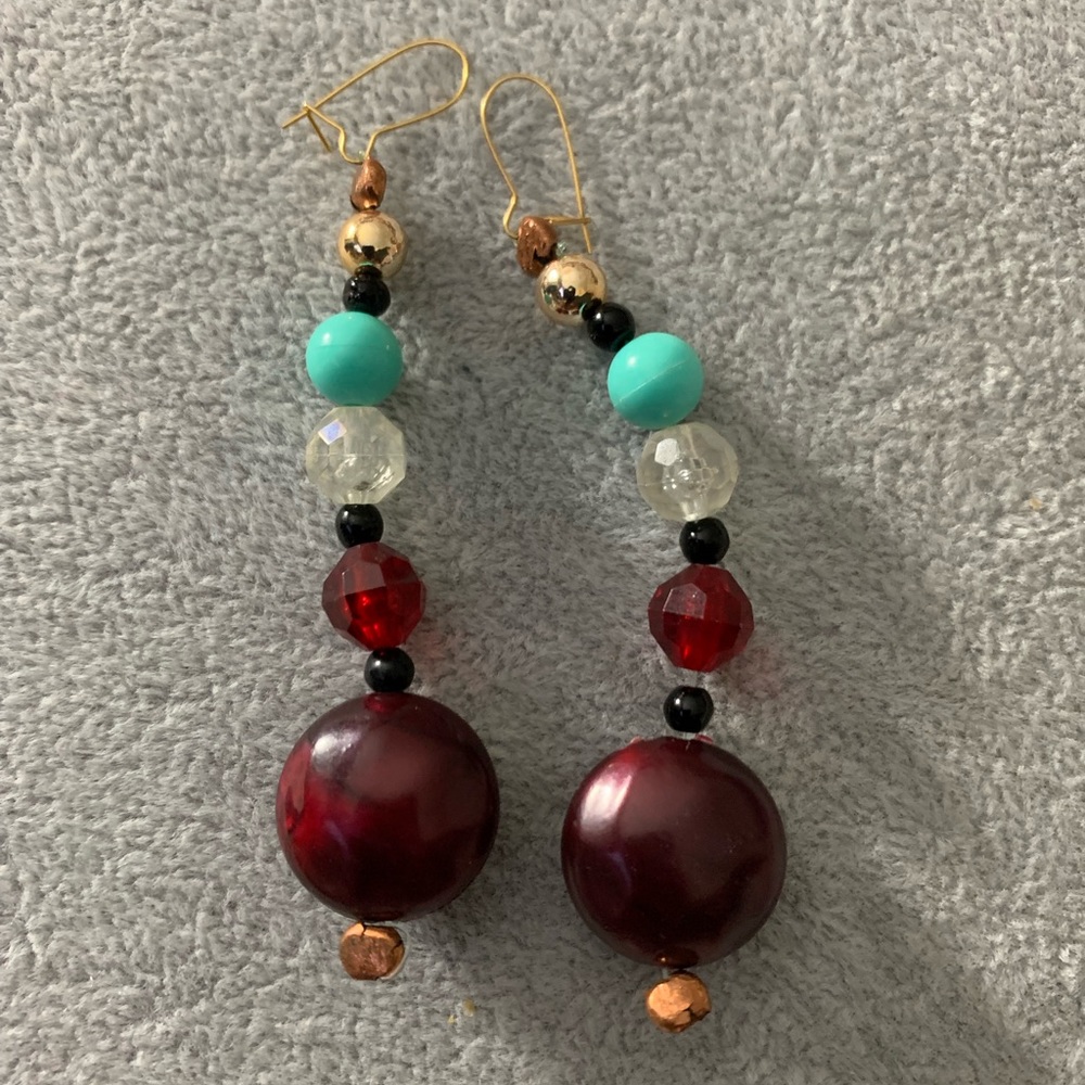 Hanging multi colored pierced earrings. New